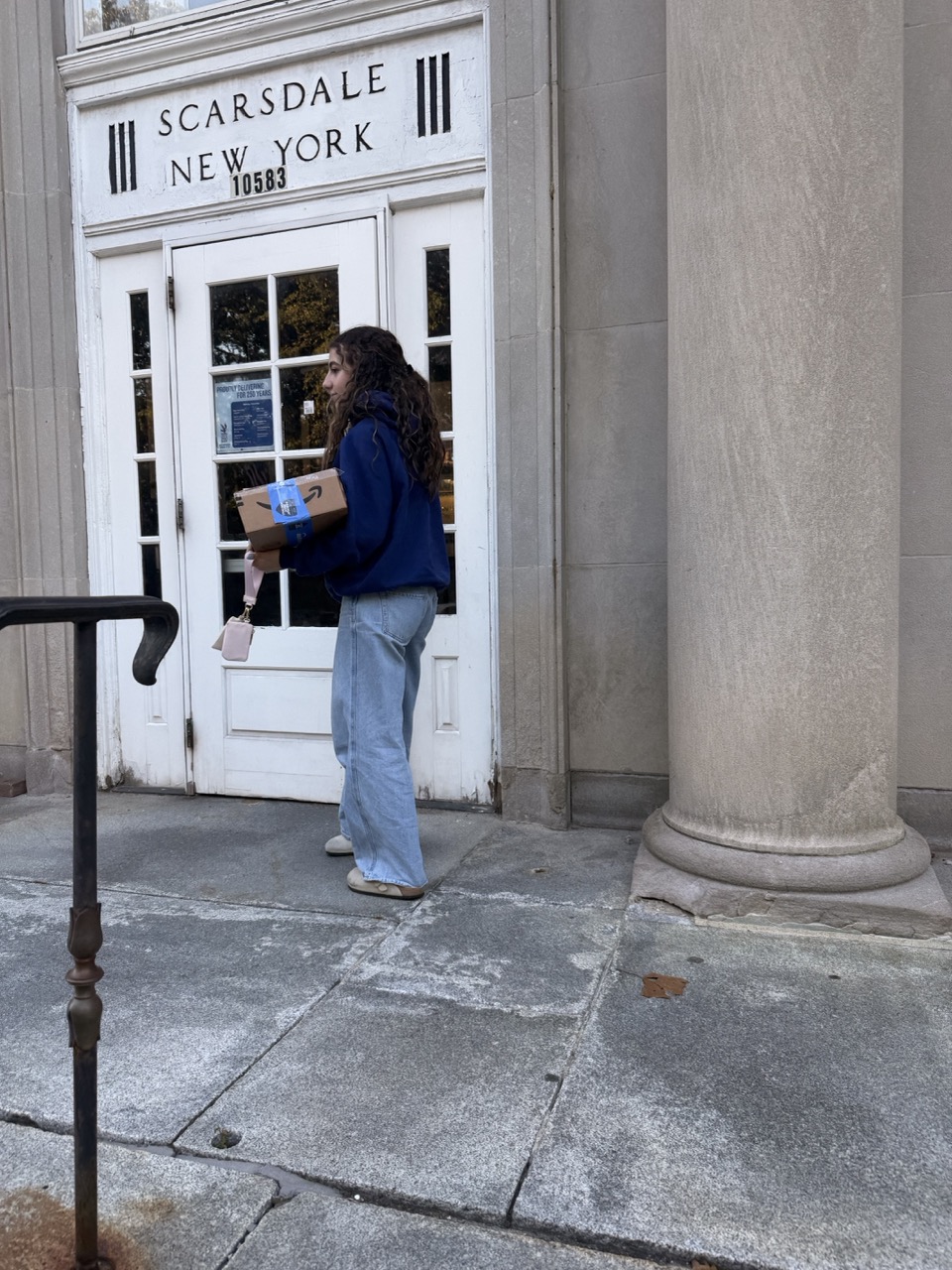 Laila at the Scarsdale, New York post office, carrying the box to ship to Palestine